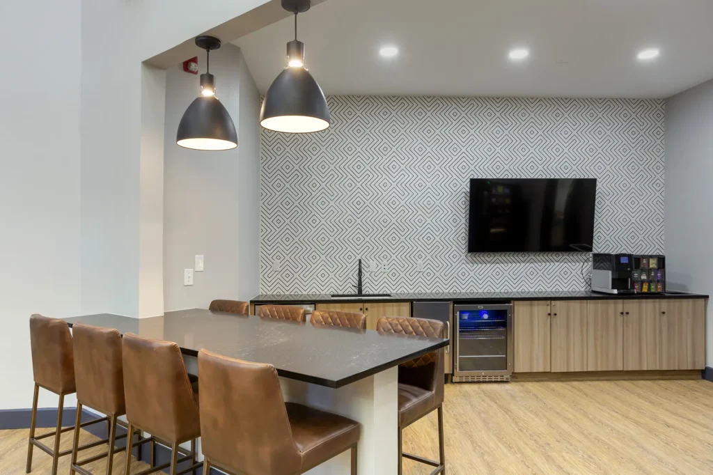 Clubhouse kitchenette with bar seating and coffee station