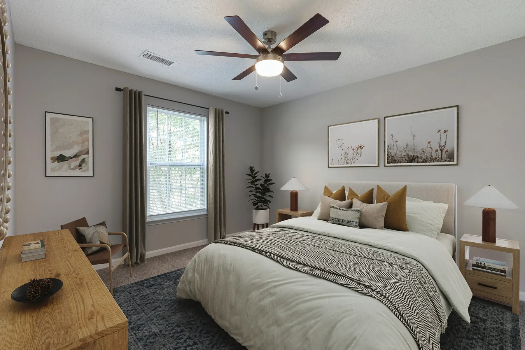 Bedroom with large window and ceiling fan