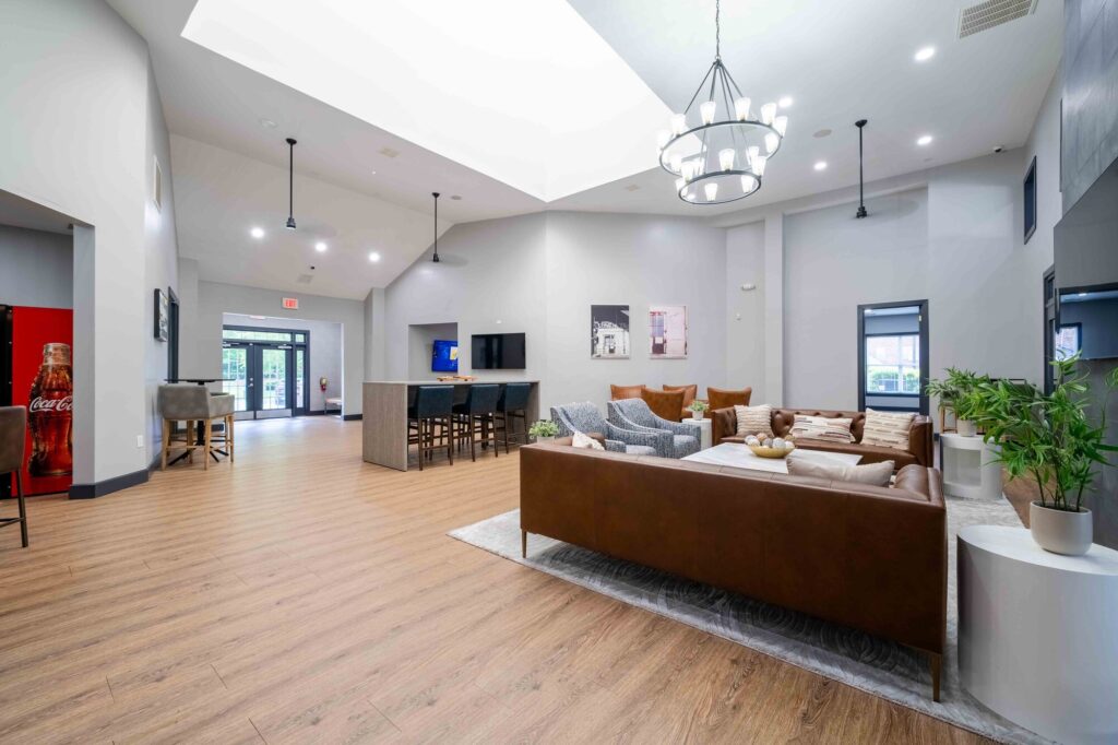 Clubhouse lounge with sofas, armchairs, and tables