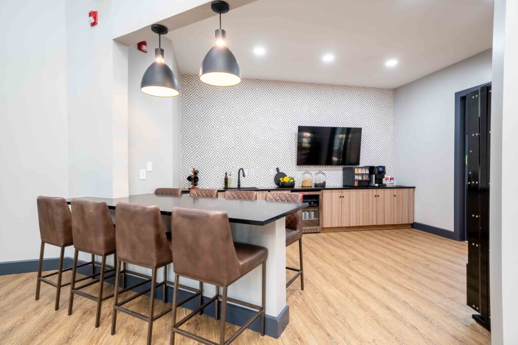 Clubhouse lounge with TV and bar height seating