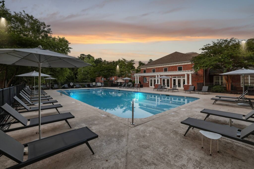 Outdoor deck with swimming pool and shaded tanning beds